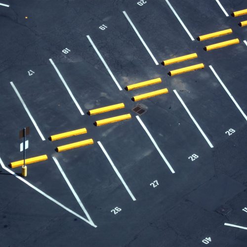 Abstract,Aerial,Shots,Of,Parking,Lot,With,White,And,Yellow