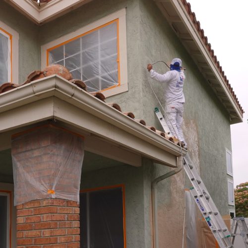 Worker,Using,A,Spray,Paint,Gun,To,Paint,The,Stucco